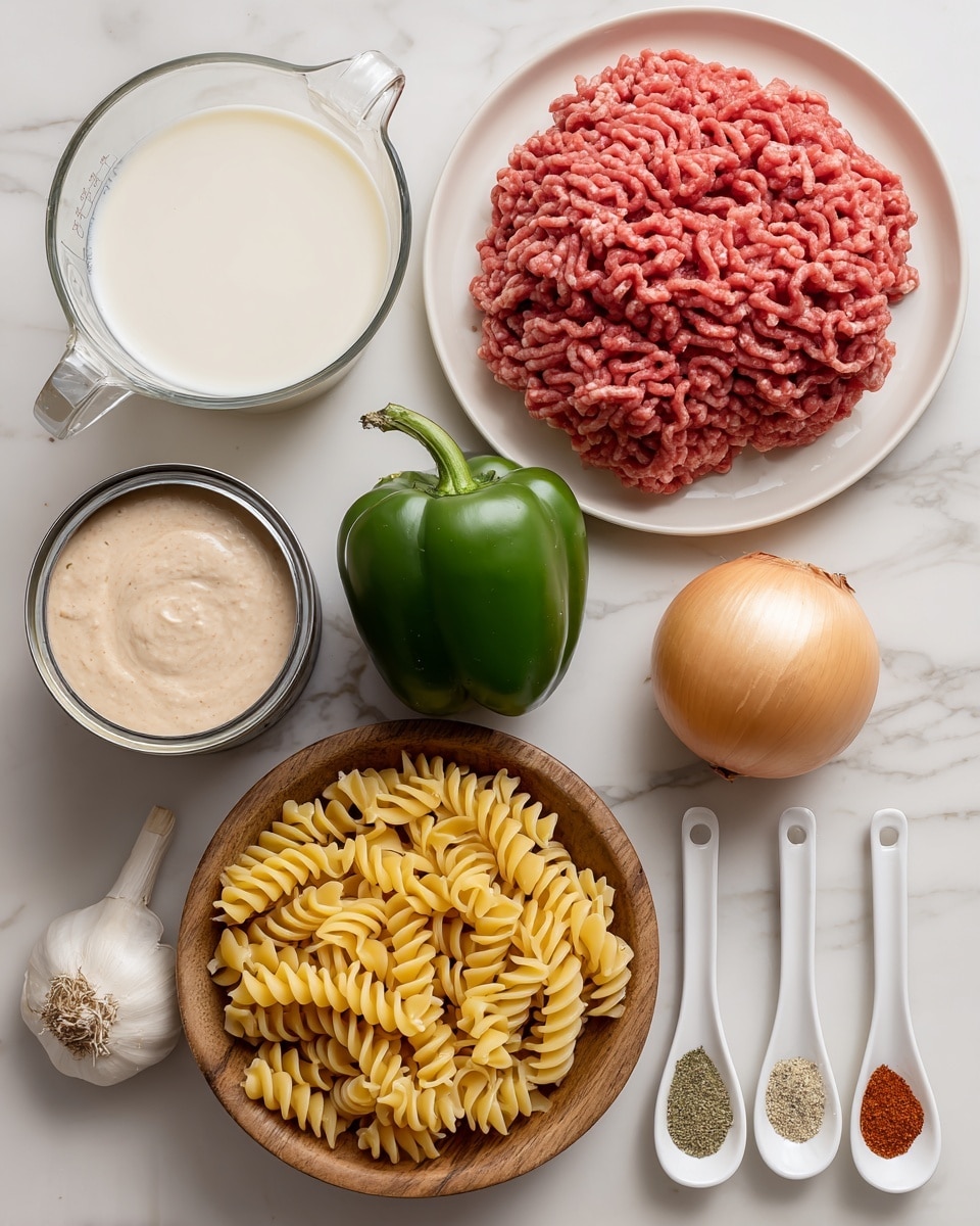 The image shows nine different cooking ingredients arranged neatly on a white marbled surface. In the top right is a white plate holding a large pile of raw ground beef, colored pinkish-red with white fat specks. To the left is a clear glass measuring cup filled with white milk. Below the milk are two metal cans, one filled with smooth pink tomato soup and the other with creamy white mushroom soup. A green pepper with a shiny, smooth surface sits below the cans. Next to the pepper is a whole round onion, off-white and papery, and beside it a whole bulb of garlic with rough white skin. At the center bottom is a wooden bowl full of uncooked yellow rotini pasta spirals. To the right of the wooden bowl are three white measuring spoons lined up vertically, each holding a dried spice: pale green parsley on top, red paprika in the middle, and brown seasoning salt at the bottom. Above the spoons, a small clear glass cup contains a tiny amount of canola oil. Photo taken with an iphone --ar 4:5 --v 7