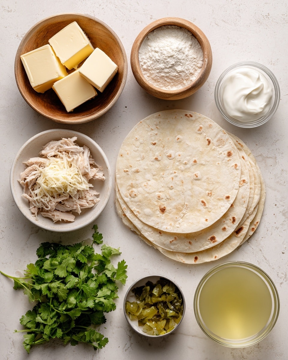 The image shows several ingredients arranged neatly on a white marbled surface. There is a small wooden bowl with three blocks of pale yellow butter at the top left. Next to it, a small wooden bowl holds white flour with a powdery texture. A clear small glass bowl contains white sour cream, positioned near the top right. A stack of light beige tortillas with light brown spots is placed on the right side. In the middle left, there is a white bowl filled with shredded white cheese. Below it, fresh green cilantro with leafy texture and stems is spread out. To the middle center, a small white bowl with shredded pale chicken meat sits next to a small open can with diced green chiles. Near the bottom right, there is a clear measuring glass with light yellow chicken broth. The setup is clean and well-lit. photo taken with an iphone --ar 4:5 --v 7
