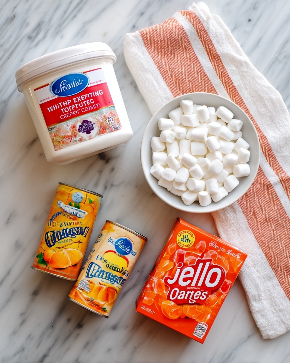 The image shows five different ingredients laid out on a white marbled surface next to a white and orange striped cloth. There is a white container with a red and blue label that reads