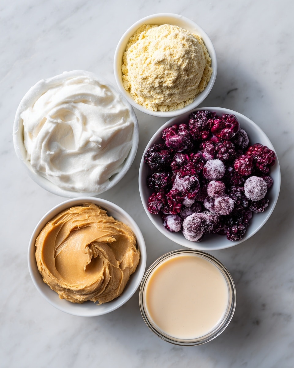 The image shows five small white bowls arranged on a white marbled surface. The largest bowl, on the right, is filled with frozen mixed berries in deep purple, red, and black colors, with a frosty texture. Above it is a medium bowl holding a round mound of pale yellow vanilla protein powder with a slightly crumbly texture. To the left of it is another medium bowl filled with smooth, thick, white Greek yogurt with soft swirls on top. Below the yogurt bowl is a smaller bowl containing creamy, light brown peanut butter with a smooth swirl. At the bottom right is a transparent glass filled with light beige almond milk, smooth and clear. photo taken with an iphone --ar 4:5 --v 7