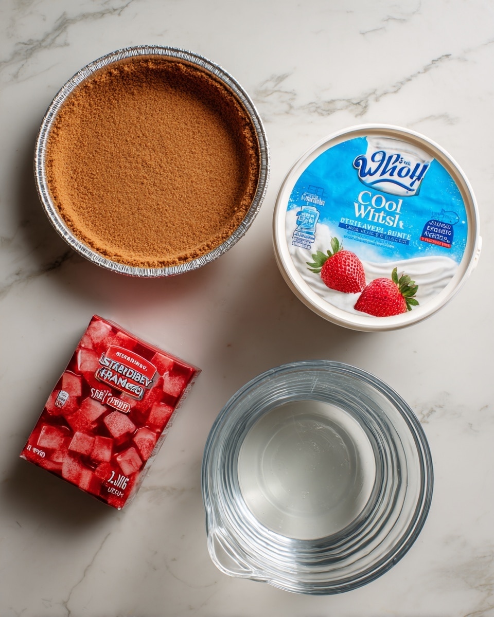 A flat lay image shows four items on a white marbled surface: at the top is a ready-made graham cracker crust in a round aluminum pan with a brown crust inside, slightly rough in texture, and a blue and white label on top; below it to the right is a large white container of Cool Whip with a bright blue label showing whipped topping and strawberries; to the left of the Cool Whip is a small red box of strawberry Jello with an image of red jello cubes and a strawberry on the front; below these, there is a clear glass measuring cup filled with water up to around 2/3 cup. Each item is labeled with bold black text naming the ingredient and amount. photo taken with an iphone --ar 4:5 --v 7