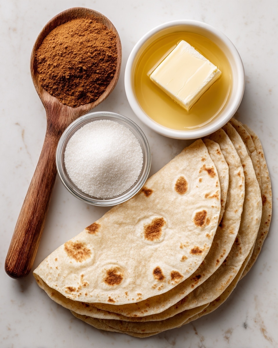 A wooden spoon holding a heap of brown cinnamon powder is positioned on the left, above the word cinnamon. In the center, there is a small clear glass bowl full of white sugar granules. To the right, a small white bowl contains melted butter with a square piece of solid butter floating on top. Below these, there is a row of eight light beige flour tortillas with small brown spots scattered across their surfaces, laid out in a slight arc. All items rest on a white marbled texture. photo taken with an iphone --ar 4:5 --v 7