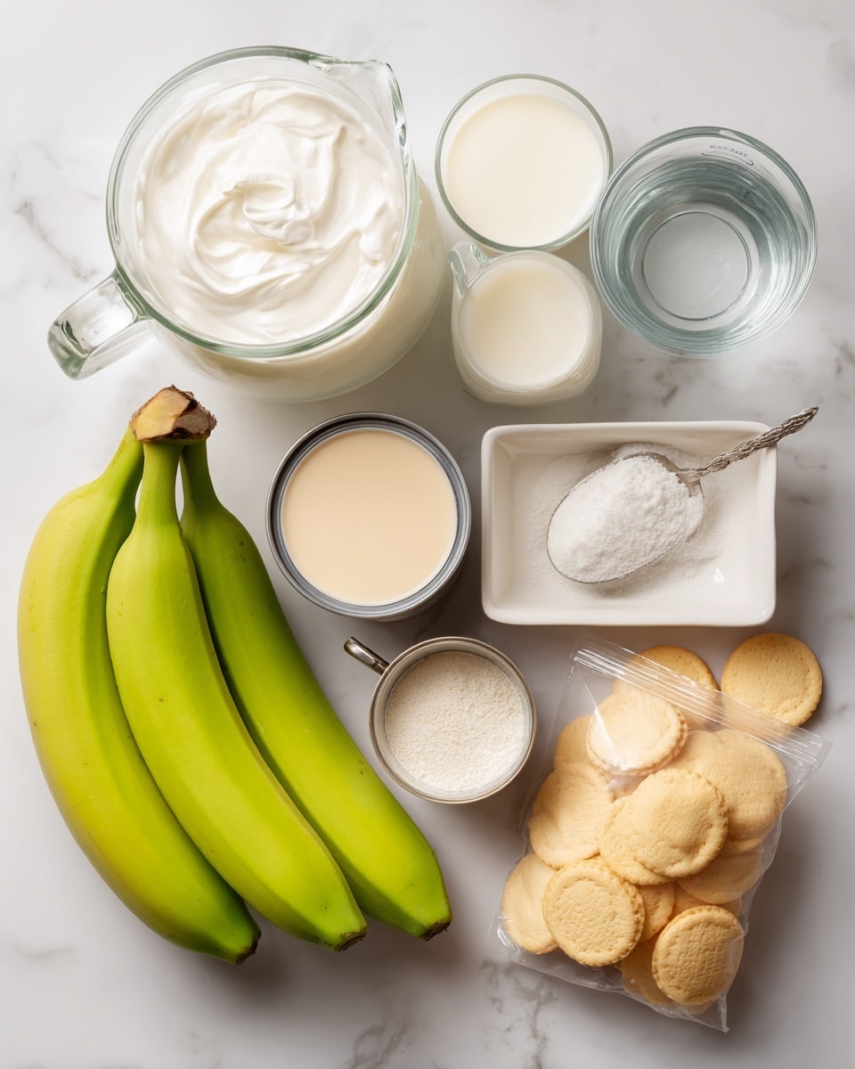 The image shows ingredients for making a dessert arranged neatly on a white marbled surface. There are three green-yellow bananas on the left side, a glass pitcher filled with white whipping cream at the top left, and a glass pitcher with light cold milk below it. Near the center, there is a small open can of light beige sweetened condensed milk. To the right, some round golden vanilla wafers spill out from a clear plastic bag. A small clear measuring cup holds cold water. A small white paper pouch contains white vanilla pudding powder. A small white rectangular dish with a silver spoon holds vanilla flavoring. The colors are soft and natural, focusing on cream, yellow, and beige tones. The arrangement is clean and balanced, with all ingredients separate and visible. Photo taken with an iphone --ar 4:5 --v 7