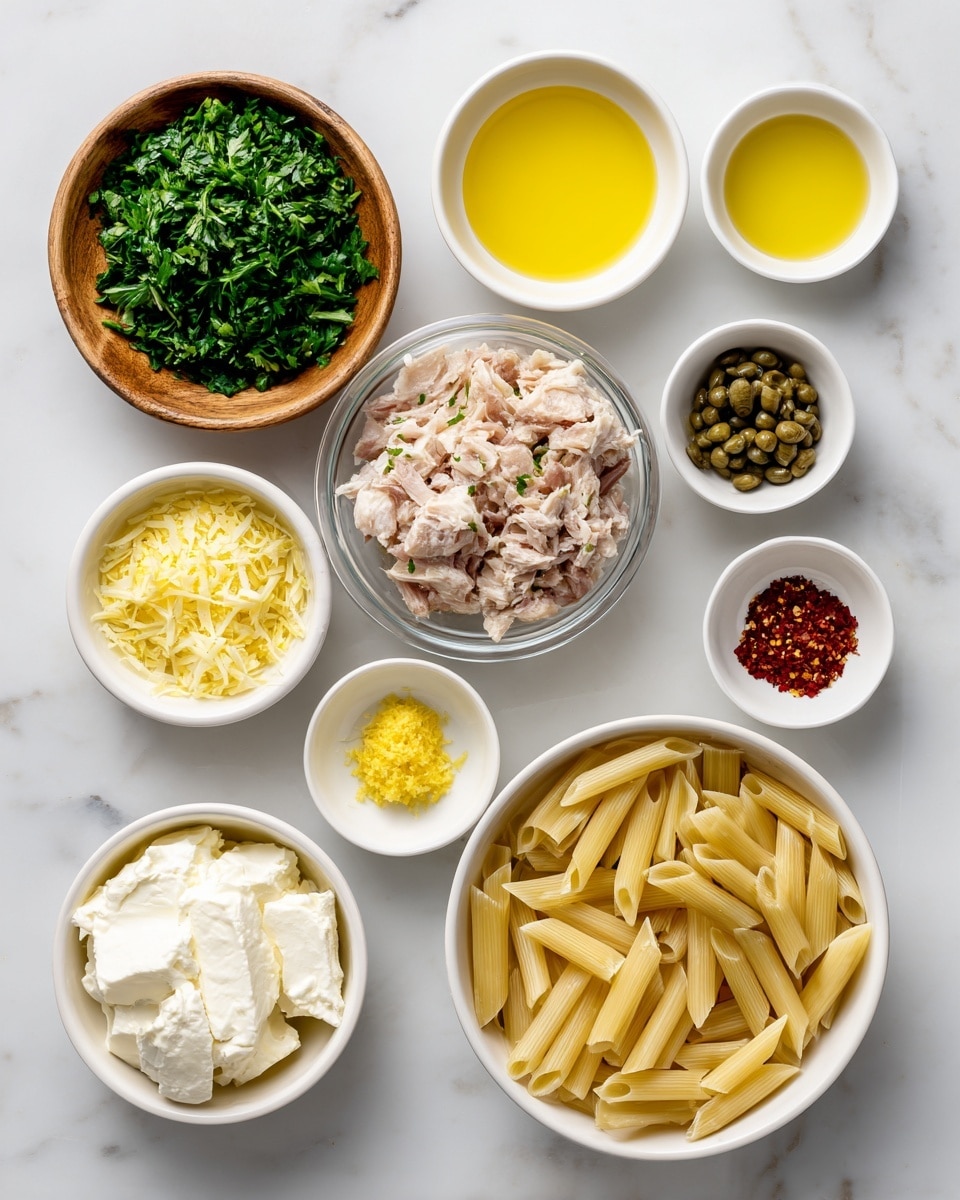 The image shows various ingredients for a recipe neatly placed on a white marbled surface. There are nine small bowls and one large bowl, all white except for one wooden bowl. Starting from the top left, there is a wooden bowl filled with chopped green parsley. To its right is a small white bowl with light yellow lemon juice, next to a small white bowl of golden olive oil. Below the olive oil is a small white bowl with greenish-brown capers. Below the parsley is a white bowl with smooth white cream cheese. Centered in the middle is a clear glass bowl full of chunk light tuna with a meaty texture. Below the lemon juice is a small white bowl of finely grated yellow lemon zest. Next to it on the right is a small white bowl with red pepper flakes. On the bottom left, there is a small white bowl with minced pale yellow garlic and next to it, a small white bowl packed with grated white parmesan cheese. Finally, at the bottom right, a large white bowl holds uncooked pale yellow penne pasta. Everything is spaced out clearly on the white marbled background, photo taken with an iphone --ar 4:5 --v 7