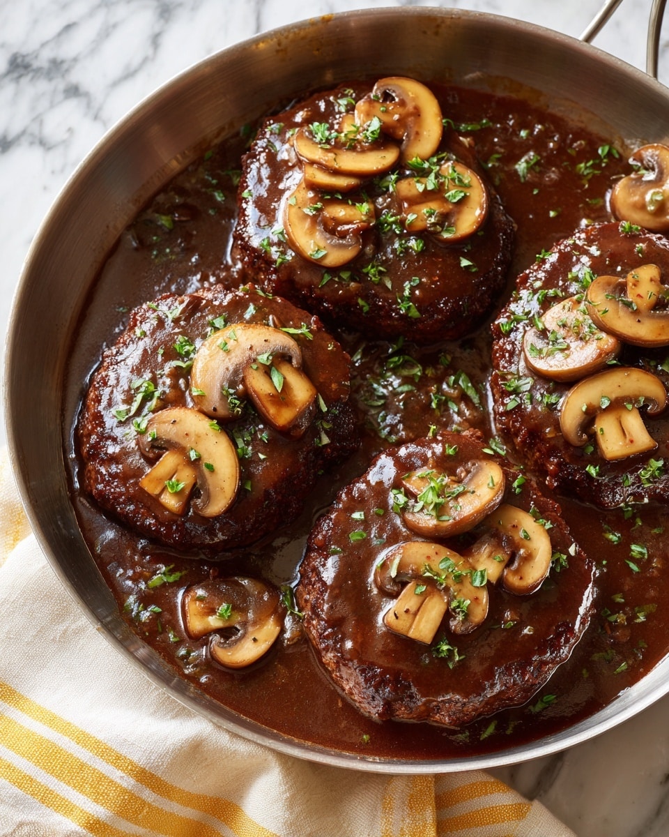 A round pan holds four thick, brown patties covered with a glossy, dark mushroom sauce. Each patty is topped with several light brown sliced mushrooms, and the sauce fills the spaces around the patties, looking rich and smooth with small bits of herbs sprinkled lightly on top. The pan sits on a light cloth with yellow stripes, and the background is a white marbled texture. photo taken with an iphone --ar 4:5 --v 7