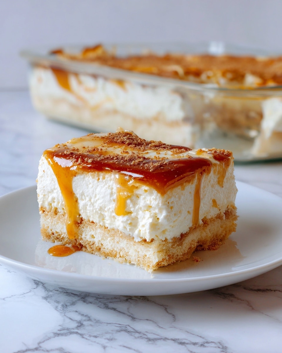 The image shows a single square piece of dessert on a white plate with a white marbled surface underneath. The dessert has three layers: the bottom layer is light golden and looks like a soft crust, the middle layer is thick and creamy white with a smooth texture, and the top layer is a glossy, caramel-colored topping with specks of cinnamon and syrup dripping slightly off the side. In the background, there is a clear glass baking dish filled with more of the same dessert. The photo taken with an iphone --ar 4:5 --v 7