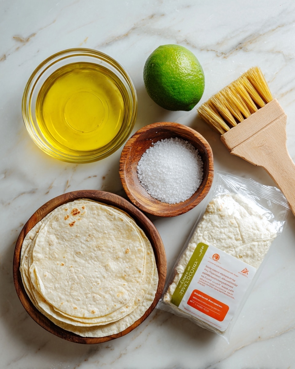 The image shows a clear glass bowl with bright yellow oil, a small round wooden bowl filled with white salt, a wooden brush with soft bristles, a pack of yellow corn tortillas wrapped in clear plastic with red and orange labels, a pack of white corn tortillas wrapped in white paper with green and red print, and a whole green lime. All these items are placed on a white marbled surface arranged neatly apart from each other. photo taken with an iphone --ar 4:5 --v 7