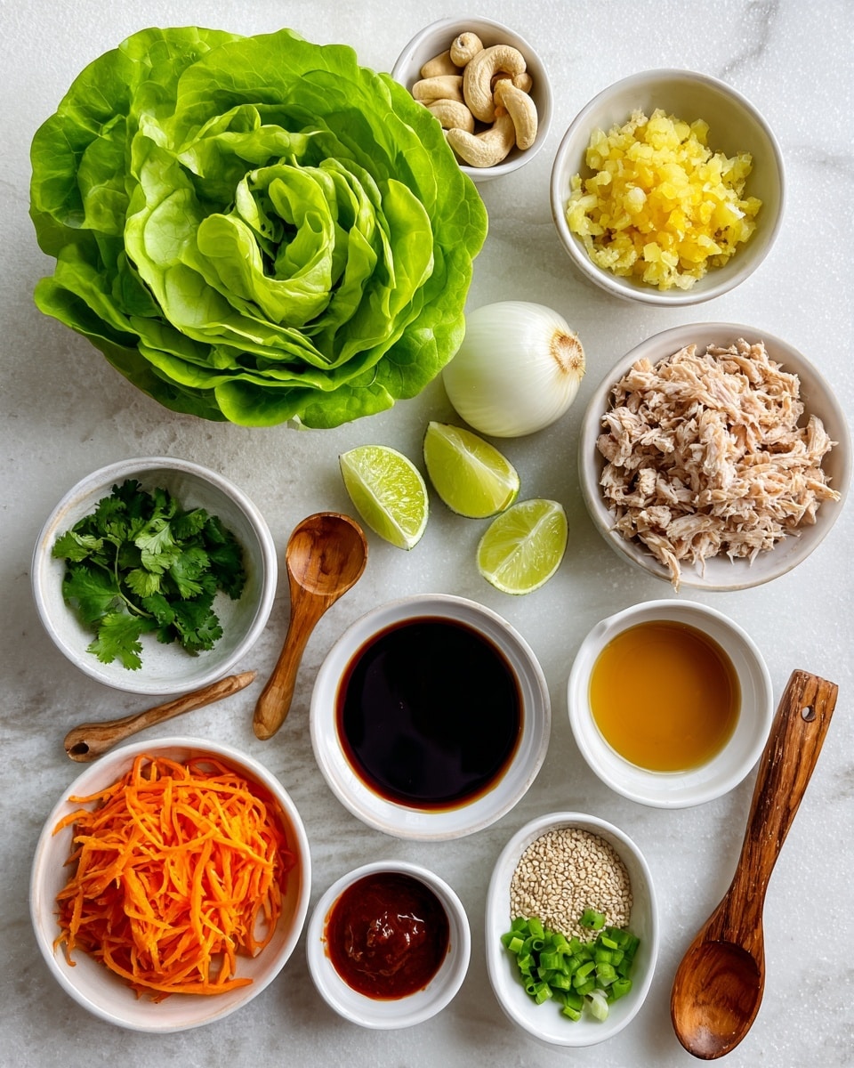The image shows a top-down view of fresh ingredients arranged neatly on a white marbled surface. At the top center is a large bright green round lettuce head with crisp, layered leaves. Surrounding it are small white bowls and containers holding different ingredients: finely chopped yellow ginger mixed with white garlic, a bowl of light beige ground chicken, thin shredded orange carrots in a white bowl, a small bowl of dark green cilantro leaves, and a small white bowl with sliced scallions. There is a halved white onion, two green lime halves, a white bowl filled with dark soy sauce in the center, a smaller bowl with amber sesame oil, and another with golden maple syrup. A wooden spoon holds reddish chili sauce, and another spoon carries light brown sesame seeds. A small white bowl contains whole cashew nuts, completing the arrangement. photo taken with an iphone --ar 4:5 --v 7