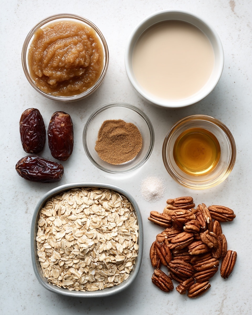 The image shows seven ingredients arranged on a white marbled surface. At the top left, a small glass bowl holds light brown applesauce with a smooth, thick texture. To the right, a white bowl filled with unsweetened non-dairy milk shows a light beige liquid surface. Next to it, a small clear glass bowl contains a small amount of golden brown vanilla extract. Below that, a similar clear bowl holds a mix of brown cinnamon powder and white salt. At the bottom center, a metal tray is filled with light beige oats, showing the textured surface of rolled oats. To the left, a small pile of dark brown dates with a wrinkled, shiny texture lies scattered. In the middle, medium brown pecans are spread out, showing their ridged, natural shapes. photo taken with an iphone --ar 4:5 --v 7