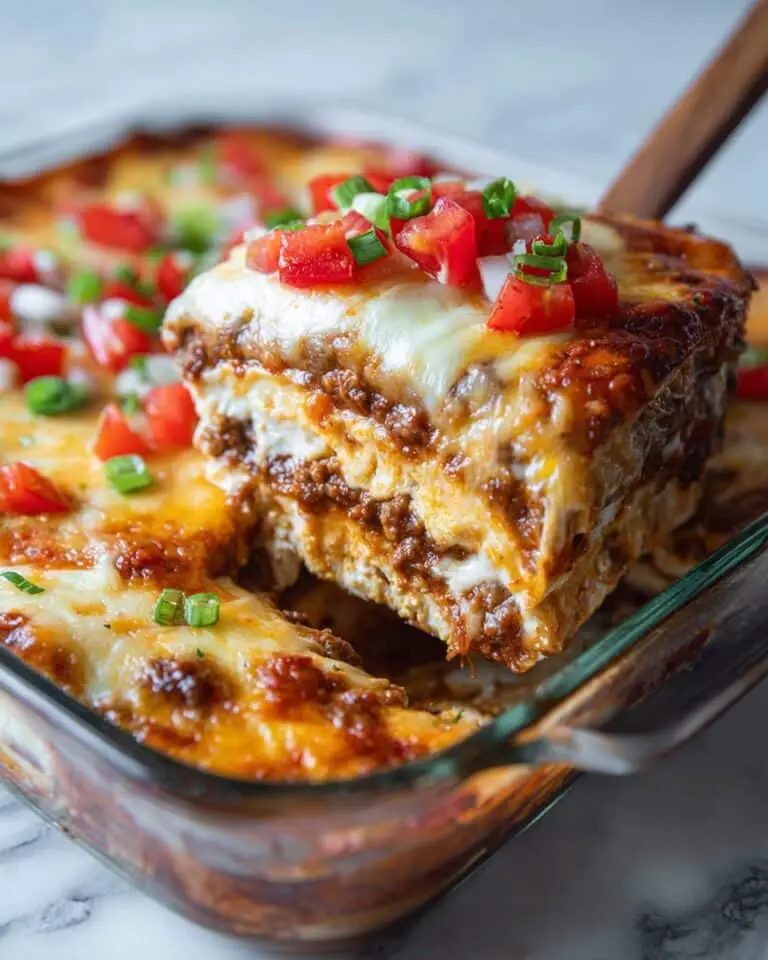 Cheesy Mexican Casserole with Ground Beef, Corn Tortillas, and Fresh Toppings Recipe