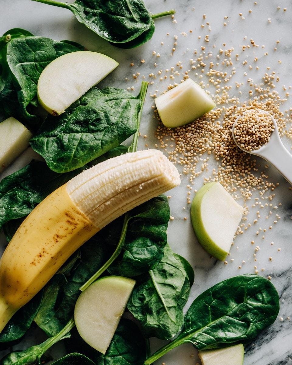 A peeled banana lies on a bed of fresh dark green spinach leaves spread unevenly over a white marbled surface. On top of the spinach are scattered small cubes and wedges of light green apple with white flesh. To the right side, a white measuring spoon  holds small beige seeds or grains, resting partially on the spinach. The overall colors are natural and fresh, highlighting the greens and yellows with soft textures and contrasts photo taken with an iphone --ar 4:5 --v 7