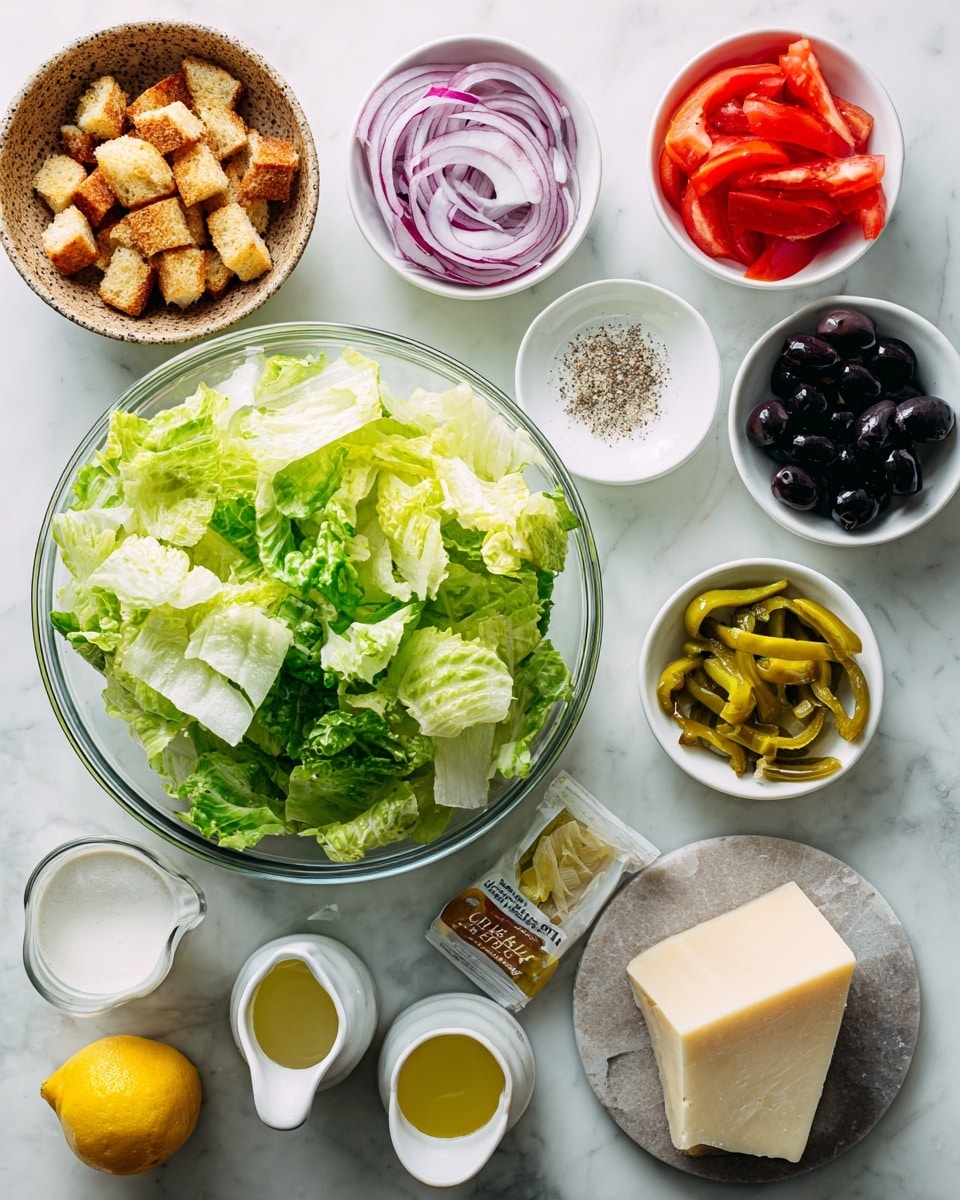 A clear glass bowl filled with fresh, chopped light and dark green romaine lettuce sits on a white marbled surface. Surrounding it are small white bowls arranged neatly: top left with thin sliced red onion rings, next with bright red tomato slices, and below with shiny black olives. Below them is a bowl of yellow-green pepperoncini peppers, next to a tiny bowl of white salt. To the left, there is a brown speckled bowl full of golden-brown croutons. Below that are small white pitchers with clear liquid and yellow oil, a small bowl with white creamy dressing, another with coarse black pepper, and a wedge of pale yellow cheese on a small stone plate. A fresh yellow lemon and a packet of Italian salad dressing mix are also laid out. Photo taken with an iphone --ar 4:5 --v 7