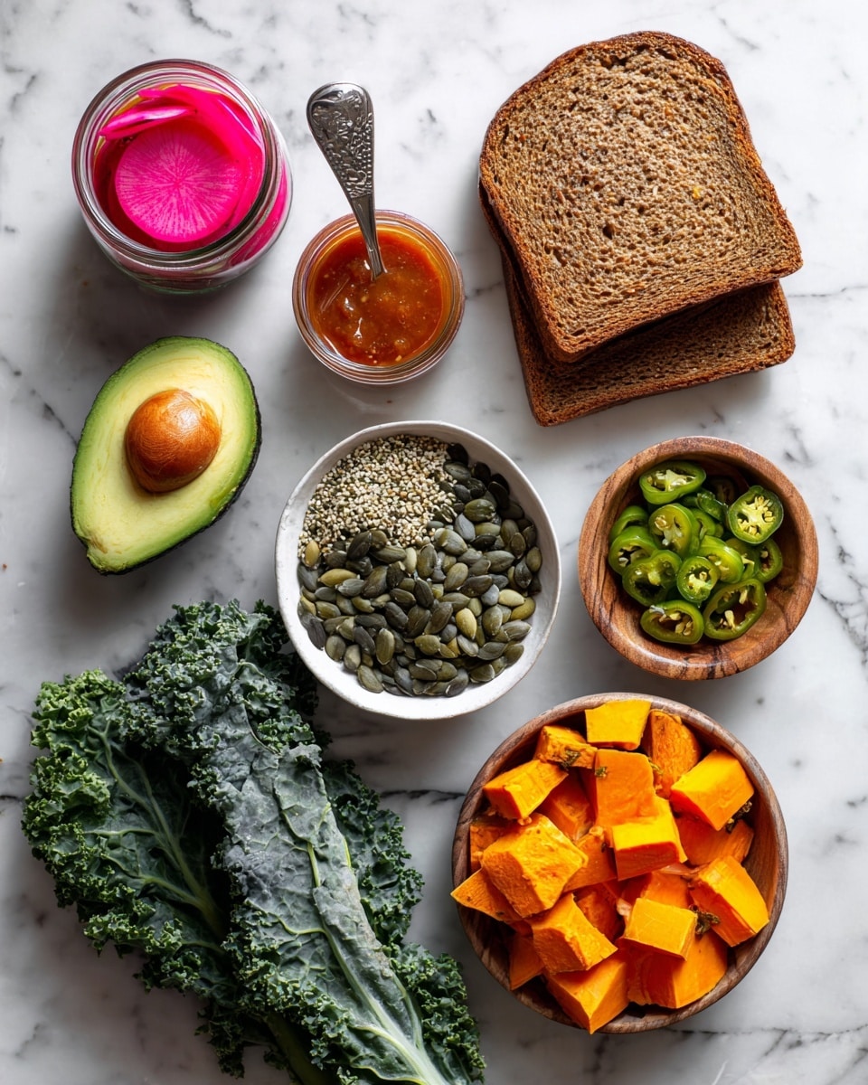 The image shows several food ingredients arranged neatly on a white marbled surface. There is a stack of three slices of brown bread on the top right, with a small white bowl filled with light green hemp seeds just left to the bread. Below that is another small white bowl filled with dark green pumpkin seeds (pepitas). To the right of this bowl are scattered bright orange and yellow chunks of sweet potatoes. On the bottom left, a bunch of dark green kale leaves with a label around the stems lies flat. Above that, a dark green avocado is placed near the center. Next to the avocado is a small light wooden bowl filled with sliced green serrano peppers. On the top left, there are two small glass containers: one holding reddish adobo sauce and the other with bright pink pickled radishes, the second one with a spoon inside. All the items are spaced evenly and clearly visible. Photo taken with an iphone --ar 4:5 --v 7