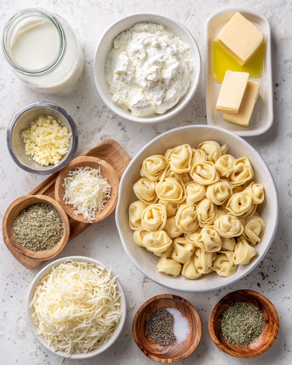 A white bowl of uncooked tortellini with a pale yellow color sits in the center on a white marbled texture. Around it are small white bowls and wooden dishes holding ingredients: at the top left, a glass jar of white heavy cream; next to it, a white bowl with a square piece of light yellow butter; to the right, a white bowl of pale yellow oil; below that, a small metal bowl of finely chopped pale yellow garlic; next to it, a small wooden bowl of greenish Italian seasoning. At the bottom left, a white bowl of shredded white mozzarella cheese, next to it, a clear bowl of light yellow shredded parmesan cheese. Small wooden bowls of white salt and black pepper sit between the bowls. All ingredients are neatly arranged in a flat lay style. Photo taken with an iphone --ar 4:5 --v 7