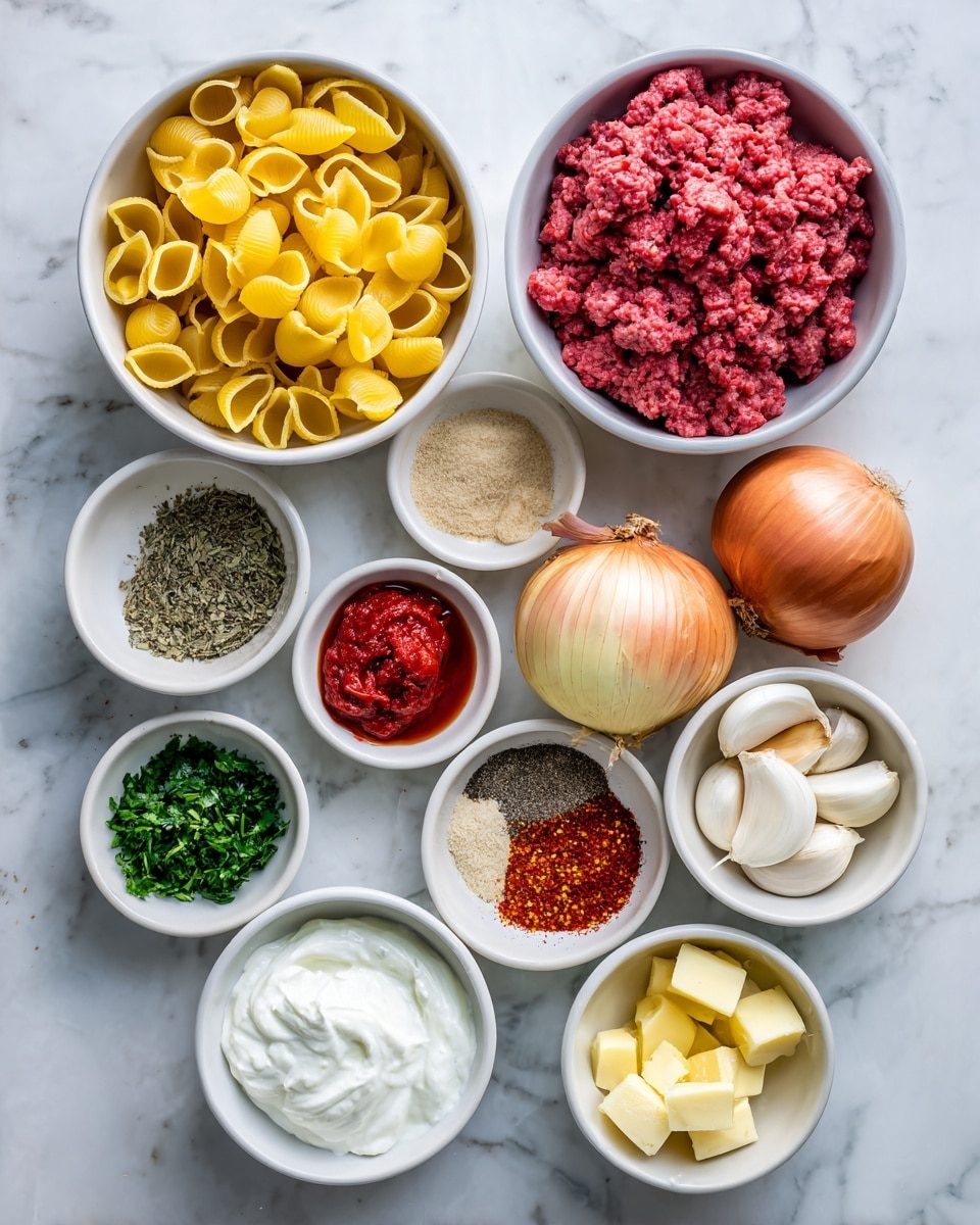 Several white bowls and two whole onions are arranged on a white marbled surface. The largest bowl on the top left holds uncooked yellow pasta shells. Next to it on the right, a large bowl contains bright pink raw ground beef. Below the pasta is a bowl full of red cherry tomatoes. A small bowl in the center holds three peeled white garlic cloves. Surrounding these are smaller bowls: one with red pepper paste, one with a beige onion powder, one with chopped dark green parsley, one with Greek yogurt showing a thick white creamy texture, one with dried mint leaves of green-gray color, one with paprika powder in bright orange-red, one with chili pepper flakes showing red and dark brown pieces, one with red tomato paste, one with light yellow olive oil, and one with white and yellow butter cubes. Two yellow onions with their dry skins still on are next to the center. Each bowl has clearly visible ingredients with a fresh and natural look. photo taken with an iphone --ar 4:5 --v 7