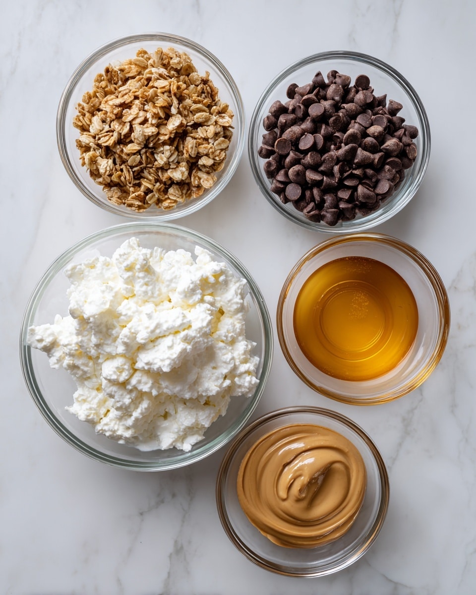 The image shows five clear glass bowls arranged on a white marbled surface. The largest bowl at the center bottom holds creamy white cottage cheese with a slightly lumpy texture. Above and slightly right is a smaller bowl filled with dark brown chocolate chips, smooth and shiny. To the left of the chocolate chips is another small bowl with light brown granola, appearing crunchy and crumbly. Below and centered between the cottage cheese and granola bowls are two bowls of sauces: the left one contains smooth, light brown peanut butter, and the right one holds a golden amber-colored honey. All bowls are white, and the whole setup is clean and bright. photo taken with an iphone --ar 4:5 --v 7
