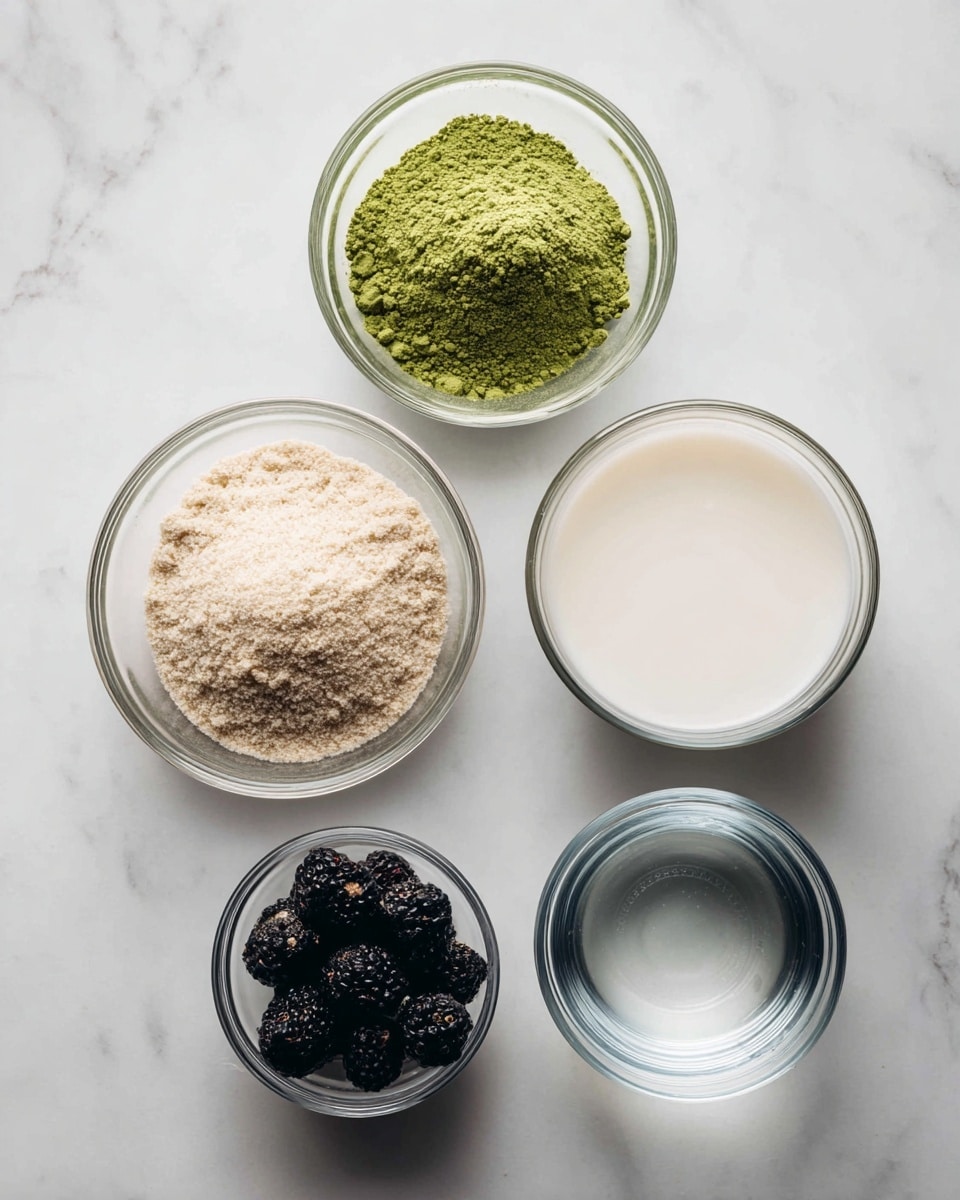 The image shows five clear glass bowls placed on a white marbled surface. The top left bowl contains a bright green powder, labeled matcha powder. To the right, a bowl is filled with a smooth, white liquid labeled almond milk. Below the matcha powder, a larger bowl holds fine, light beige granules labeled cane sugar. On the bottom right, a bowl is filled with plump, dark blackberries. At the bottom center, a smaller bowl contains clear water. Each bowl is spaced apart, neatly arranged in a roughly circular pattern. Photo taken with an iphone --ar 4:5 --v 7
