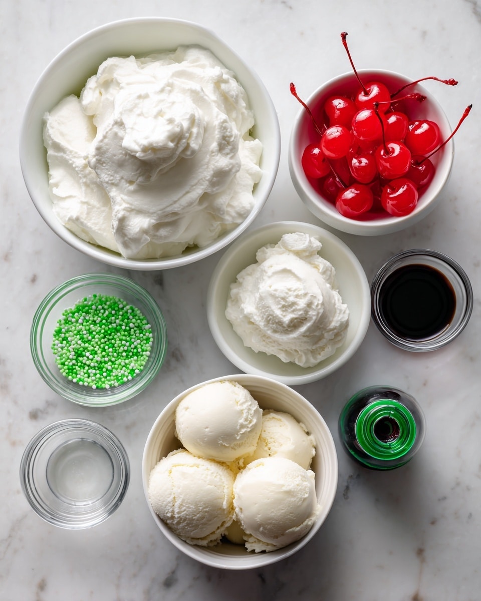 The image shows seven small white bowls and containers arranged in rows on a white marbled surface. At the top center is a bowl filled with whole milk, smooth and creamy white. Below it, to the left, is a bowl of fluffy whipped cream with soft peaks. To the right of the whipped cream is a bowl full of bright red maraschino cherries with stems. Below these are three smaller containers: on the left a bowl filled with small, bright green sprinkles; in the middle, a small clear glass bowl holding clear mint extract; and on the right, a small bottle of dark green food coloring with a green lid. At the bottom center is a bowl containing three scoops of creamy white vanilla ice cream with slight texture. The whole setup is neat and clean. Photo taken with an iphone --ar 4:5 --v 7